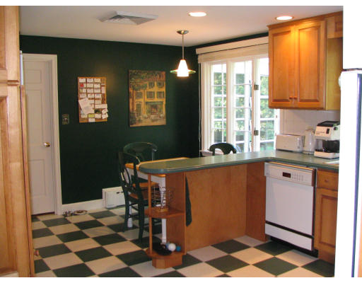 39 McCall Road Winchester, MA 01890 - Photo 8 of 11 a blue kitchen with stainless steel appliances granite countertop a refrigerator and a sink