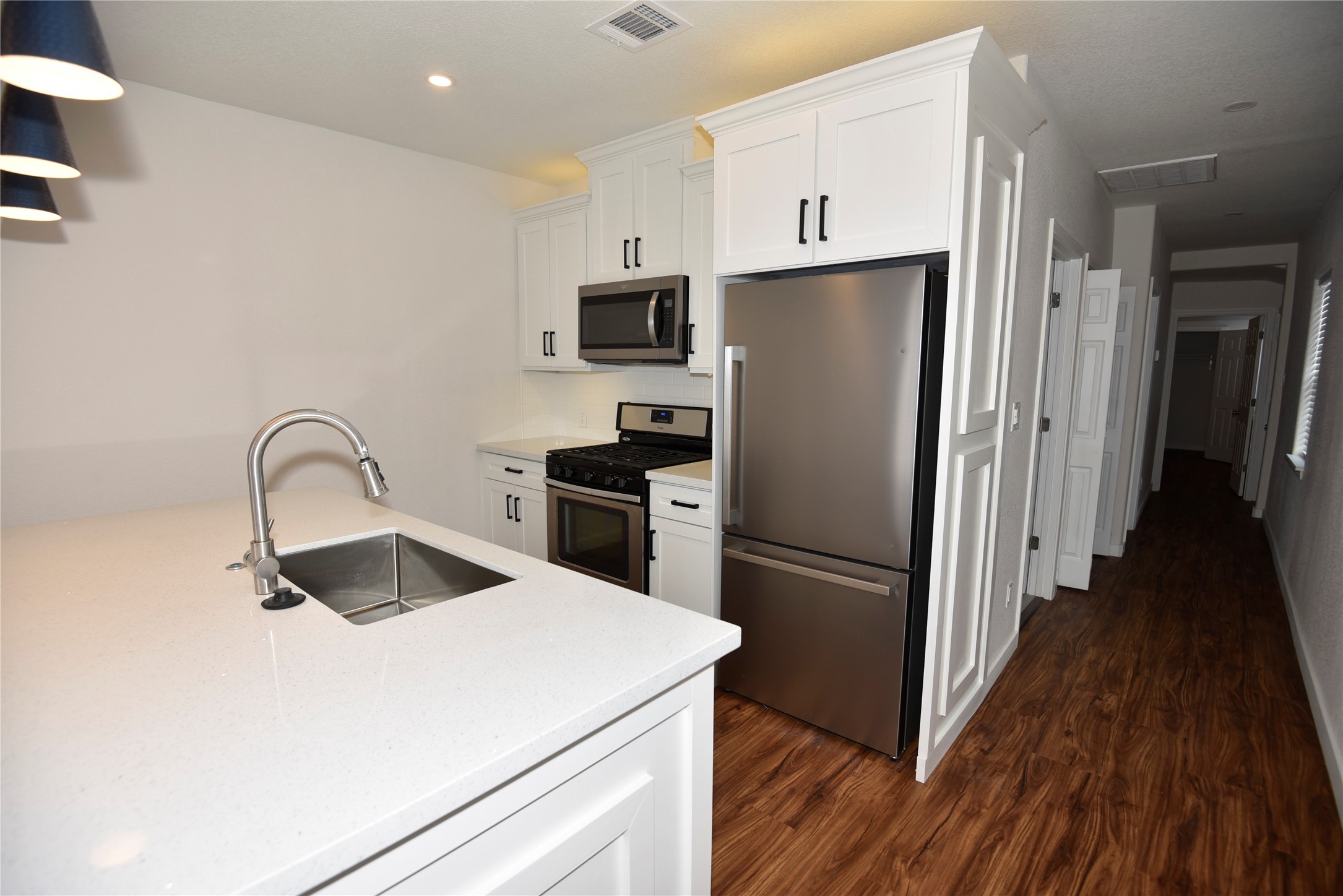 4322 Allen Street Houston, TX 77007 - Photo 13 of 17 a kitchen with a refrigerator sink and cabinets