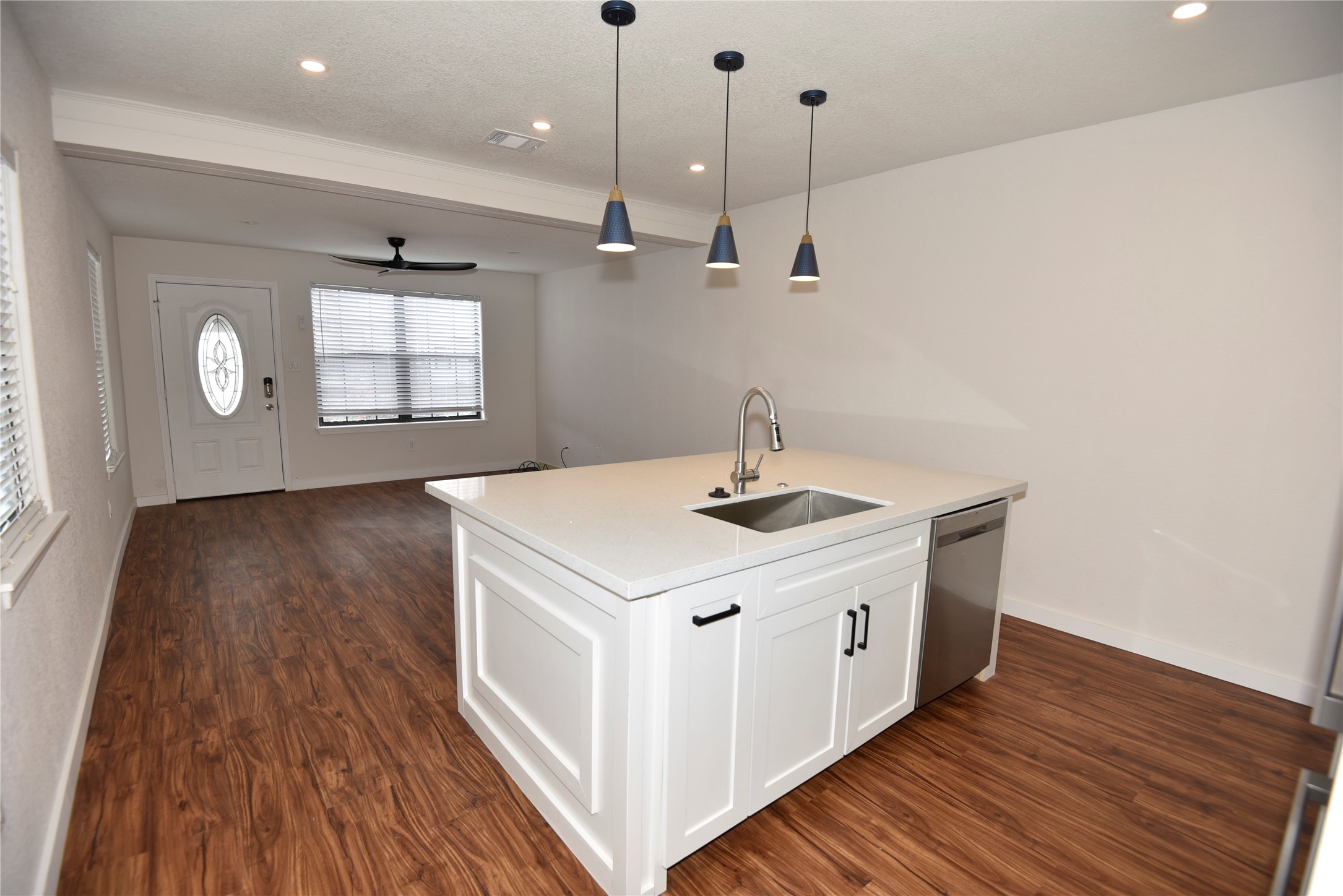 4322 Allen Street Houston, TX 77007 - Photo 2 of 17 a kitchen with a sink a window stainless steel appliances and cabinets