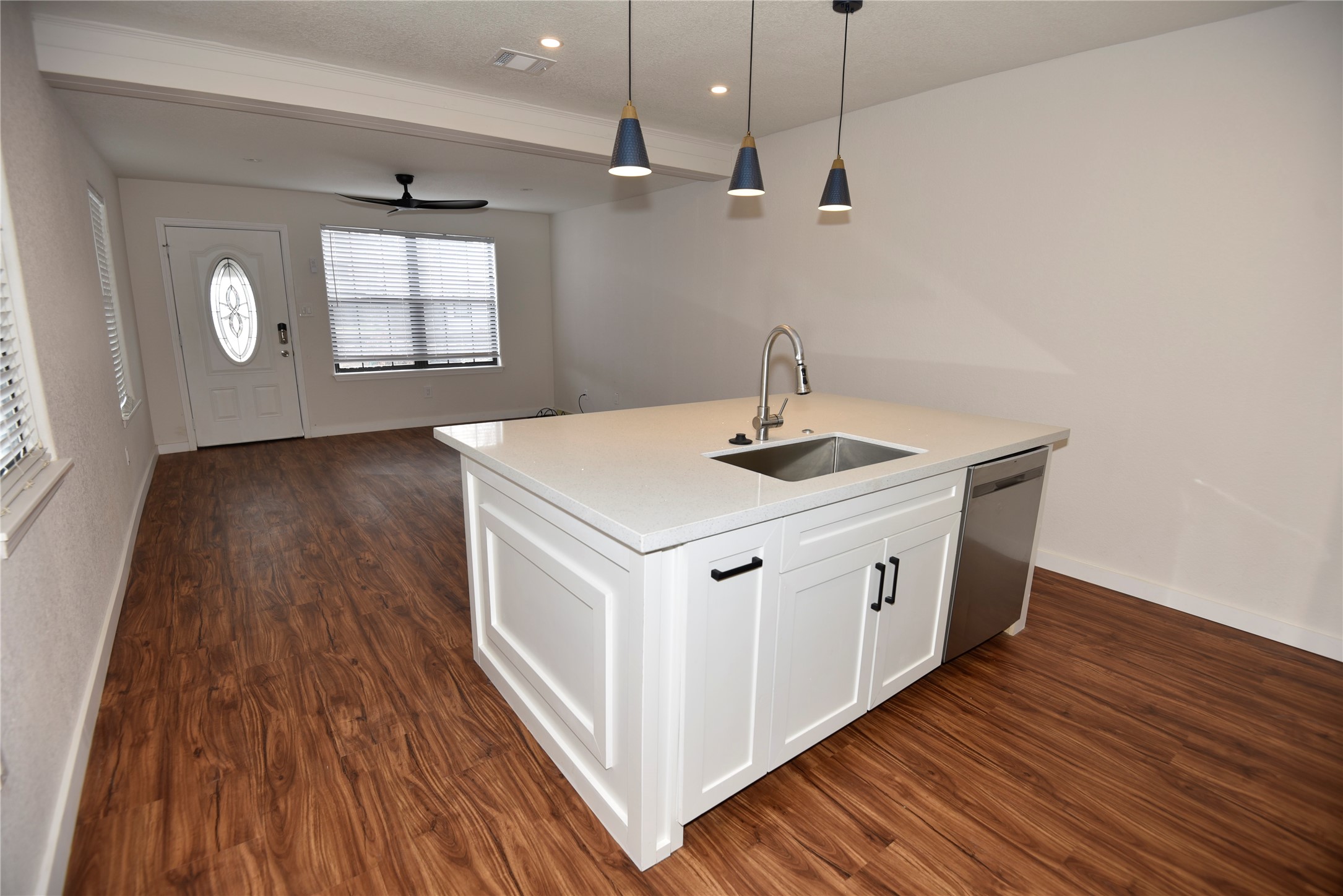 4322 Allen Street Houston, TX 77007 - Photo 3 of 17 a white kitchen with sink and wooden floor