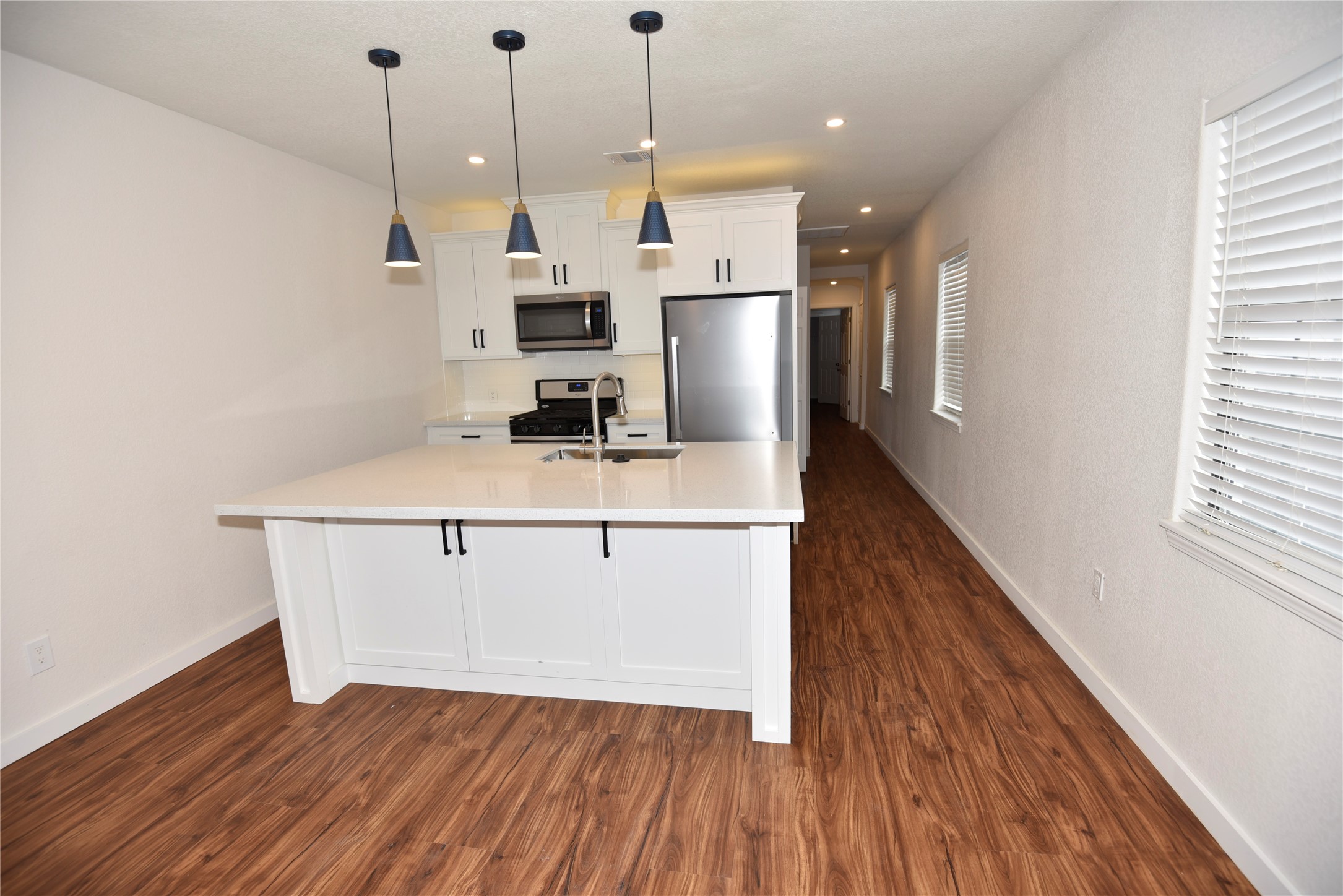 4322 Allen Street Houston, TX 77007 - Photo 4 of 17 a view of kitchen and wooden floor