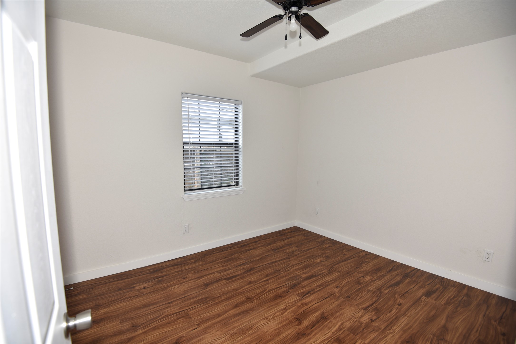 4322 Allen Street Houston, TX 77007 - Photo 10 of 17 an empty room with a hardwood and ceiling fan