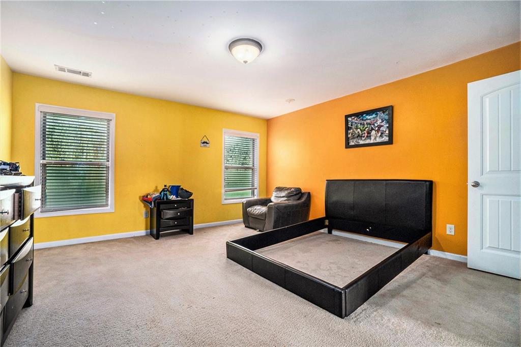 566 Olympic Way Acworth, GA 30102 - Photo 21 of 29 a living room with furniture and a flat screen tv