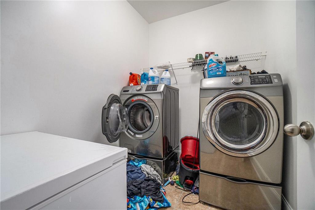 566 Olympic Way Acworth, GA 30102 - Photo 26 of 29 a utility room with dryer and washer
