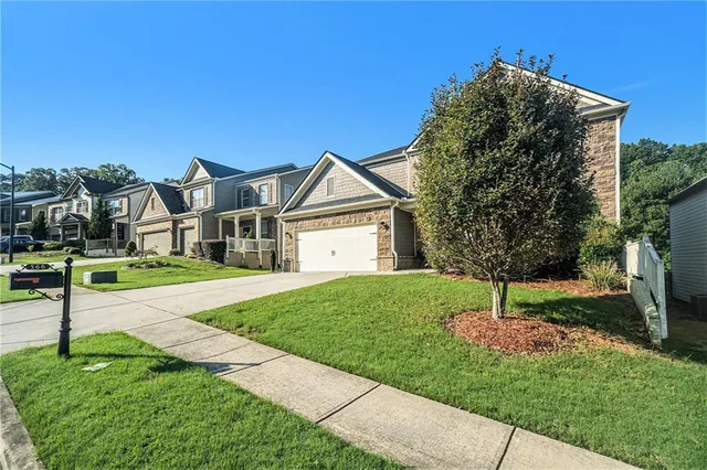 a view of a house with a back yard