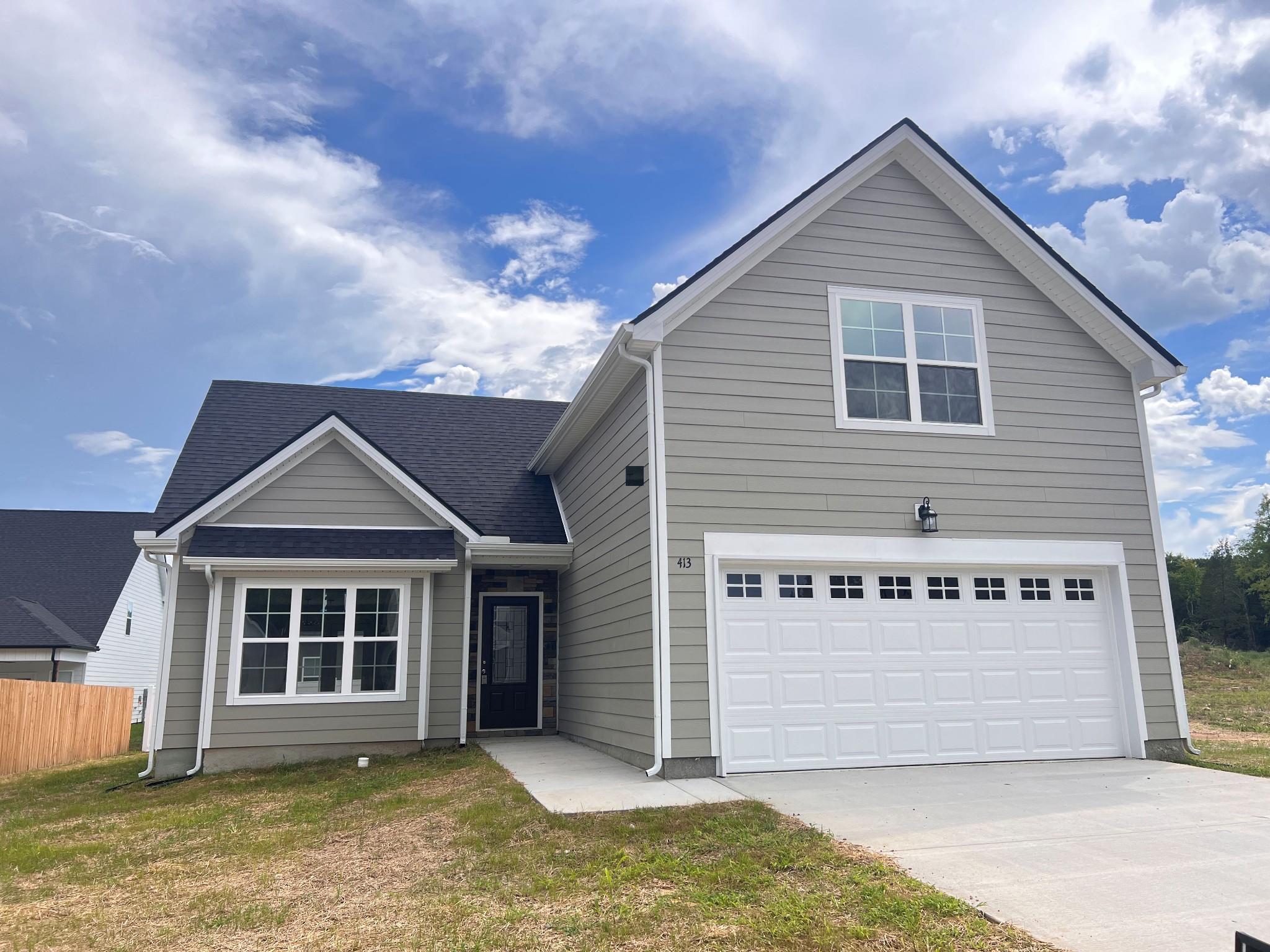 a front view of a house with a garage