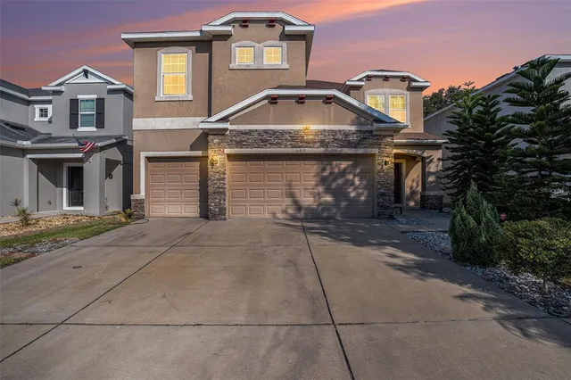 a front view of a house with yard