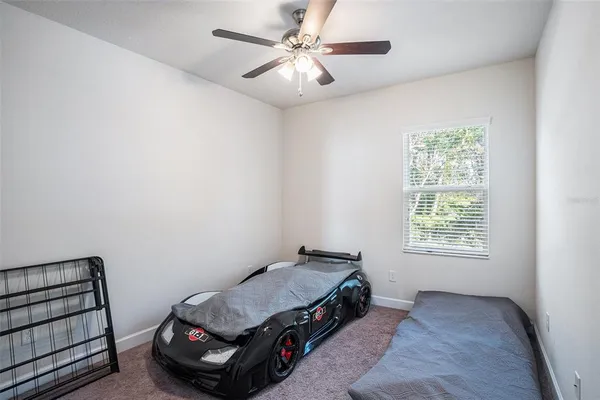 a room with a bed and a window