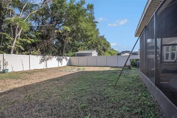 a backyard of a house with a swing