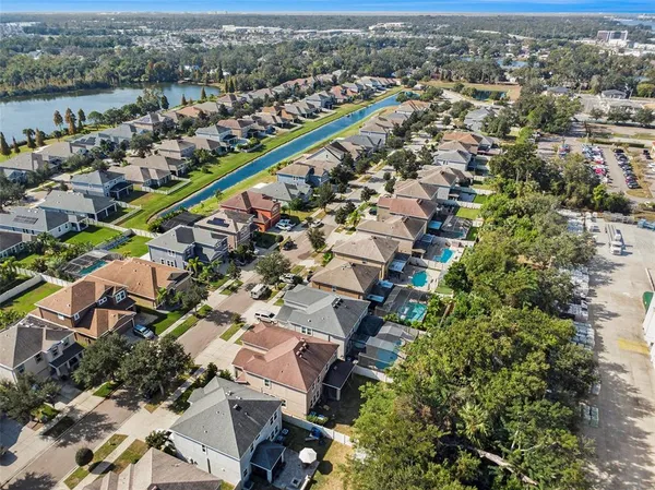 an aerial view of a city with mountains