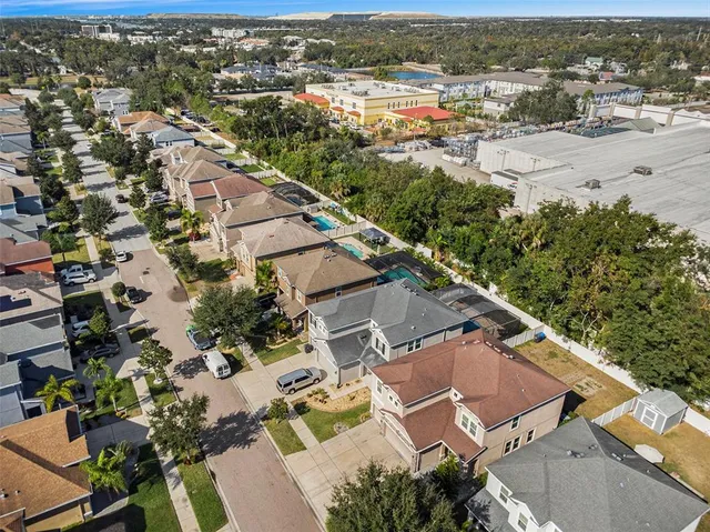 an aerial view of residential houses with outdoor space