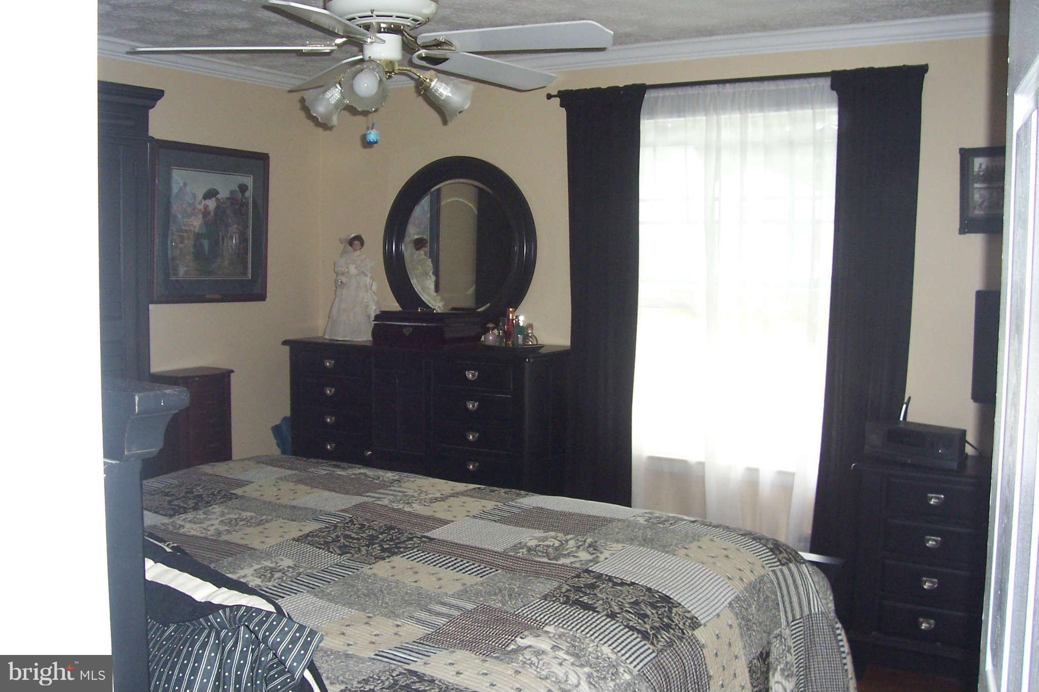 32 Yew Road Baltimore, MD 21221 - Photo 12 of 30 a bedroom with a bed and a dresser