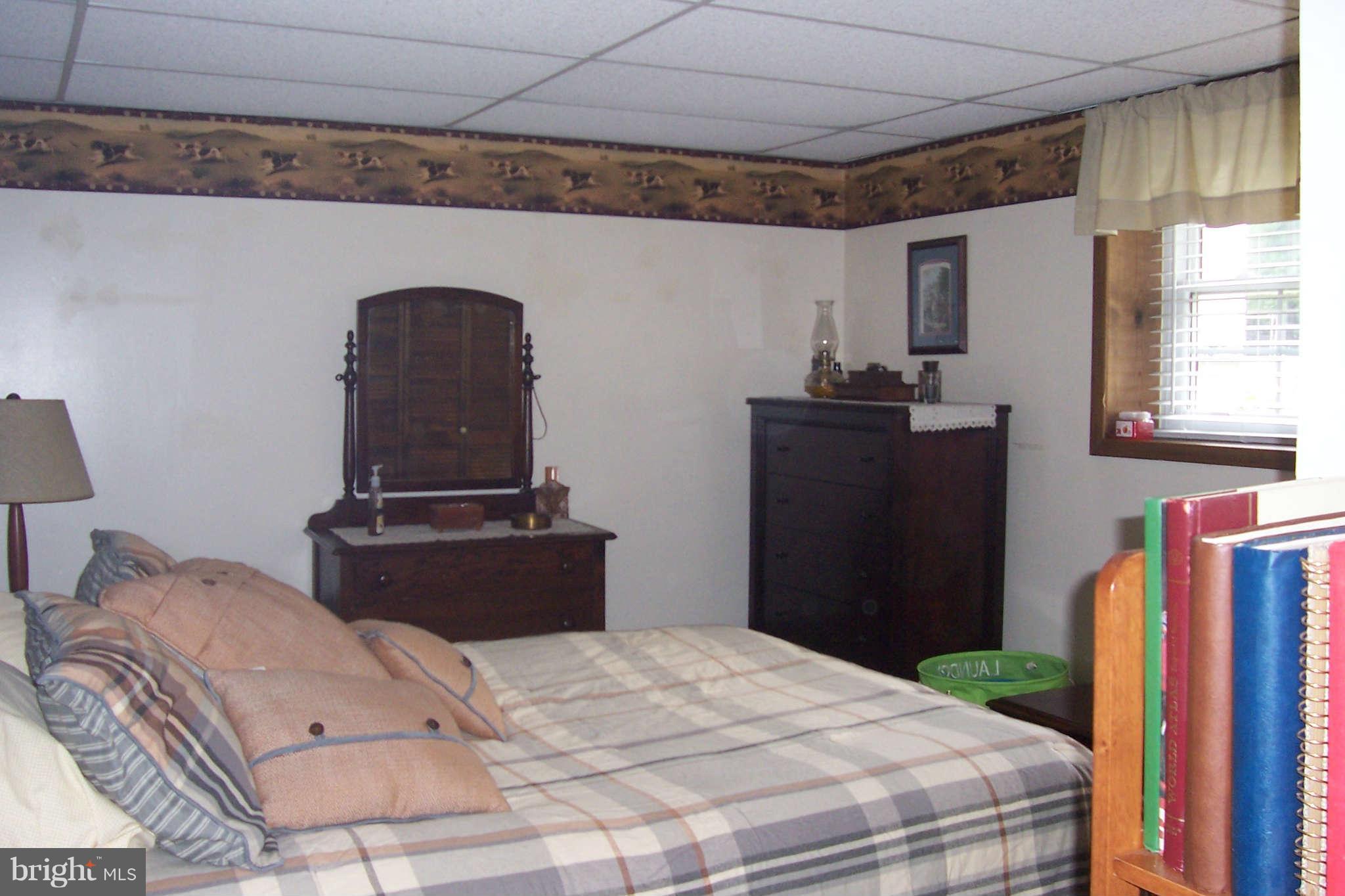 32 Yew Road Baltimore, MD 21221 - Photo 15 of 30 a bedroom with a bed and a dresser