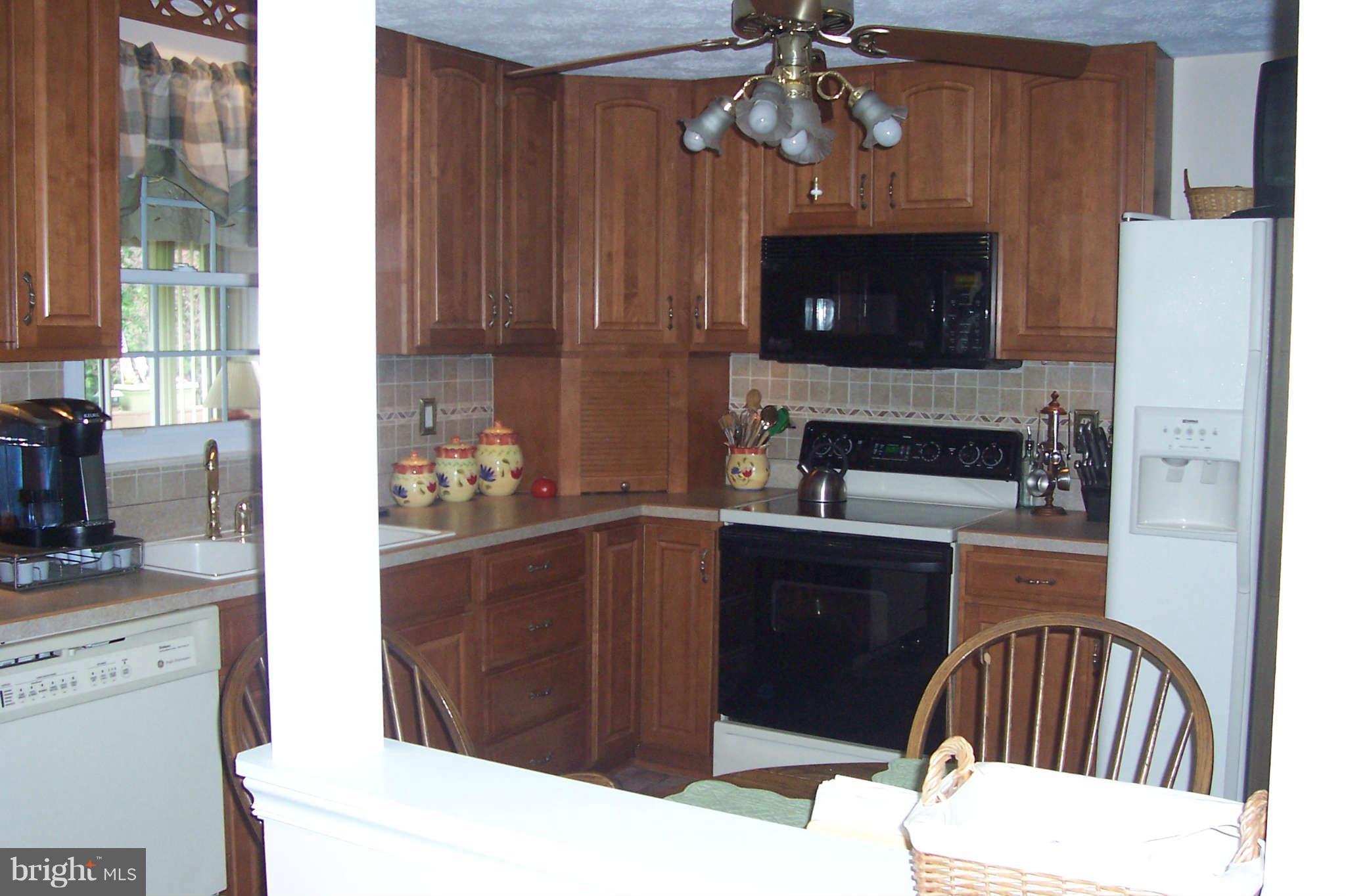 32 Yew Road Baltimore, MD 21221 - Photo 7 of 30 a kitchen with a sink stove and microwave