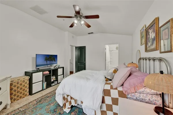 a bed room with a bed and a television