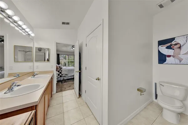 a spacious bathroom with a sink a toilet and shower