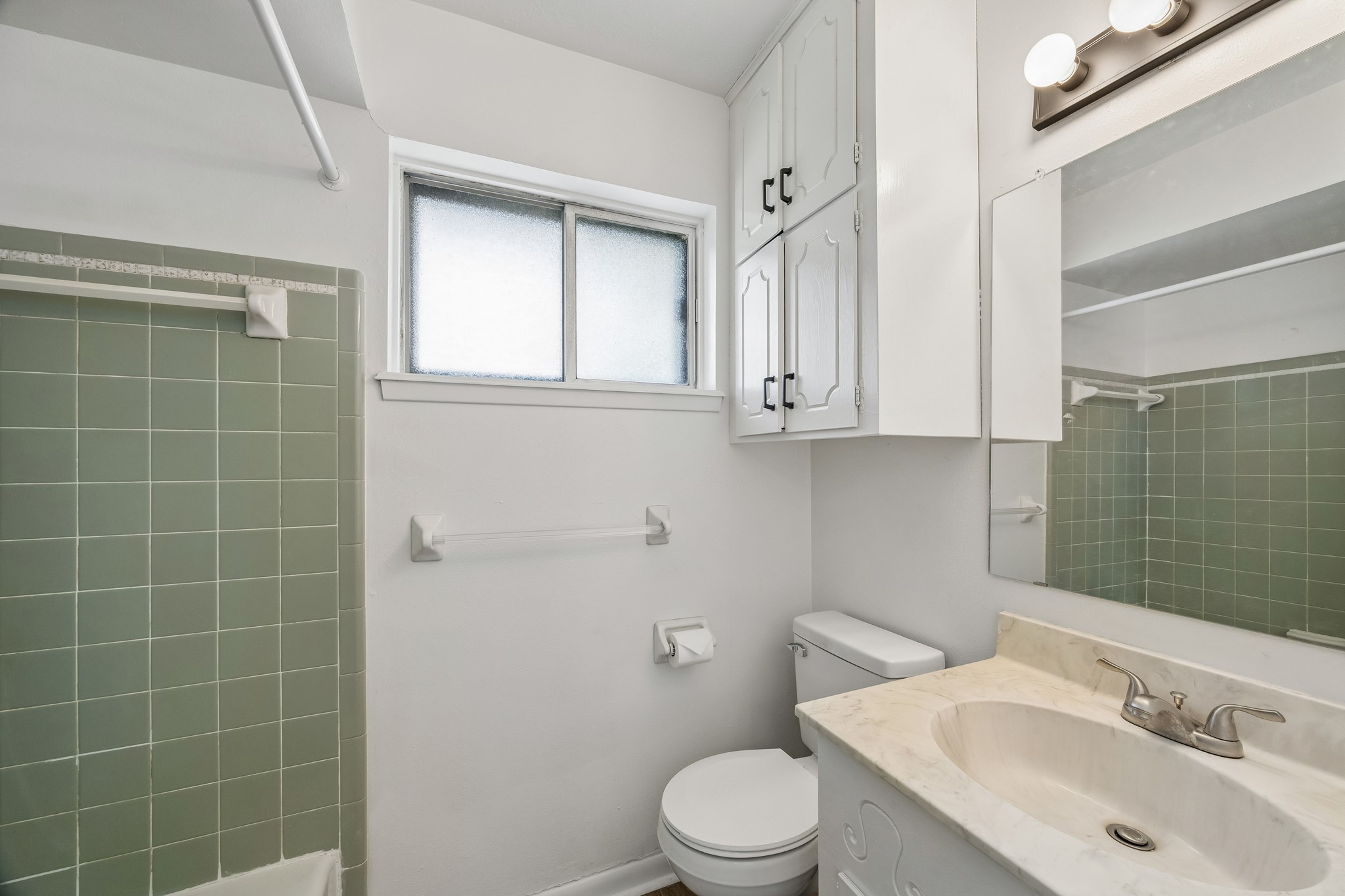 4903 Mistletoe Road Pasadena, TX 77505 - Photo 10 of 10 a bathroom with a sink toilet and shower