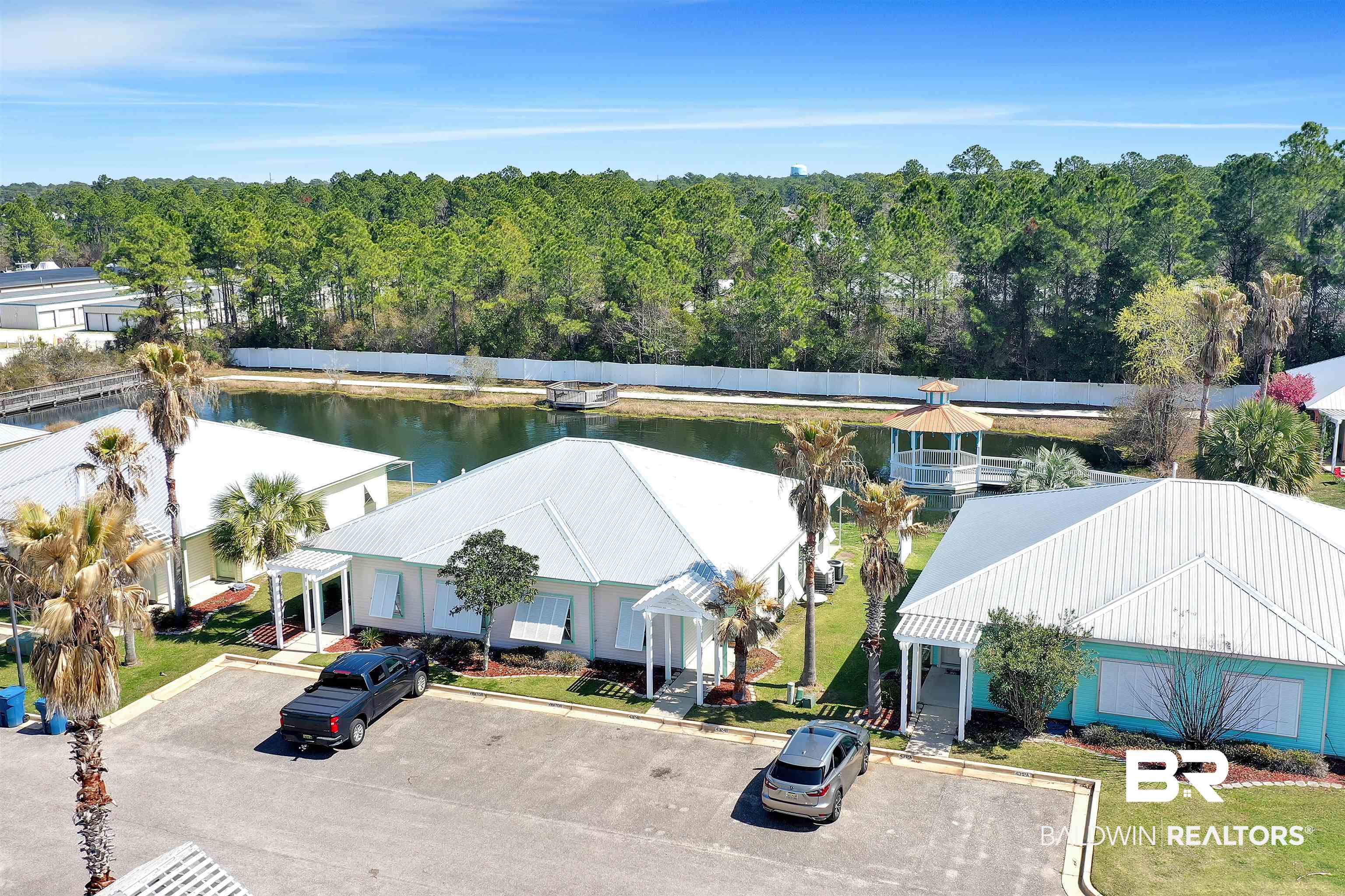 4324 B Lindsey Lane, Unit 4324B Orange Beach, AL 36561 - Photo 24 of 33 Drone / aerial view featuring a wooded view