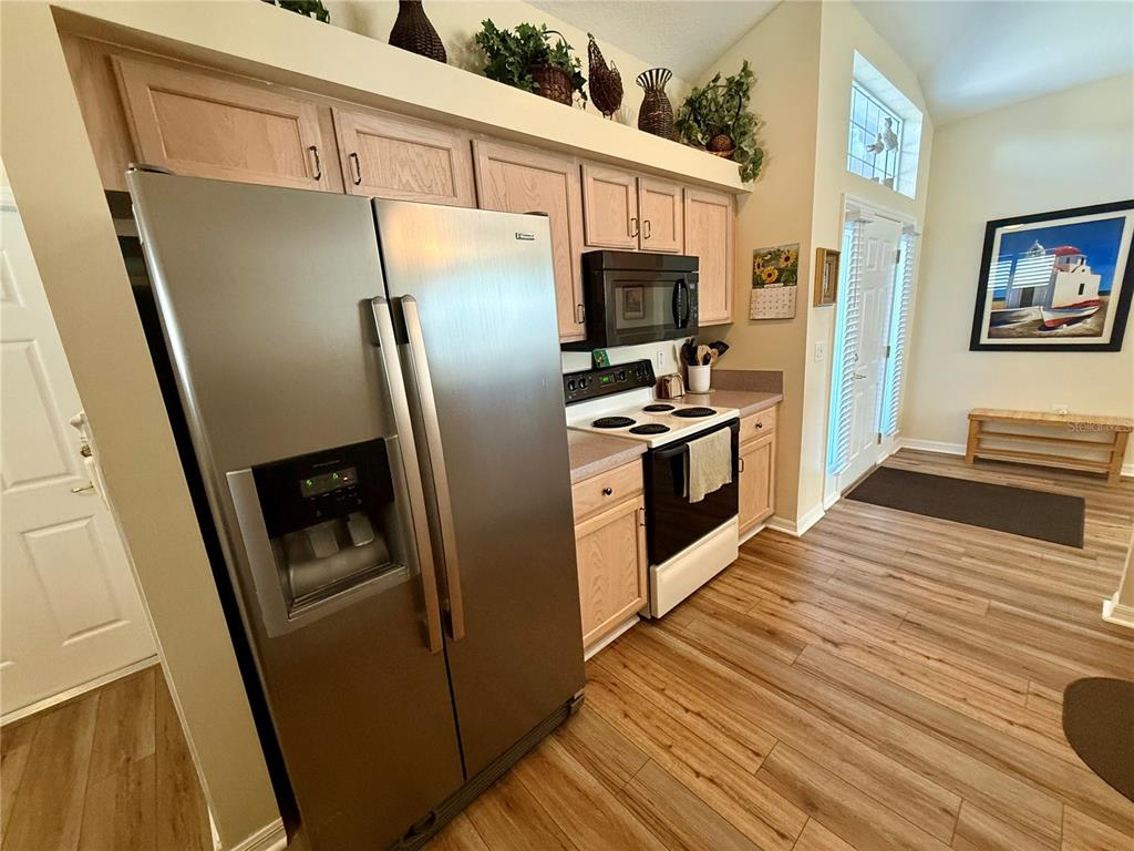 11122 Southwest 73rd Court Ocala, FL 34476 - Photo 15 of 36 a kitchen with stainless steel appliances a refrigerator stove and microwave