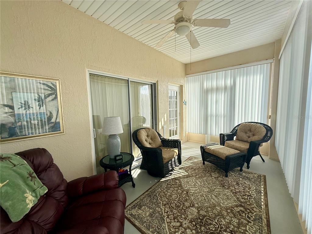 11122 Southwest 73rd Court Ocala, FL 34476 - Photo 33 of 36 a living room with furniture and a large window