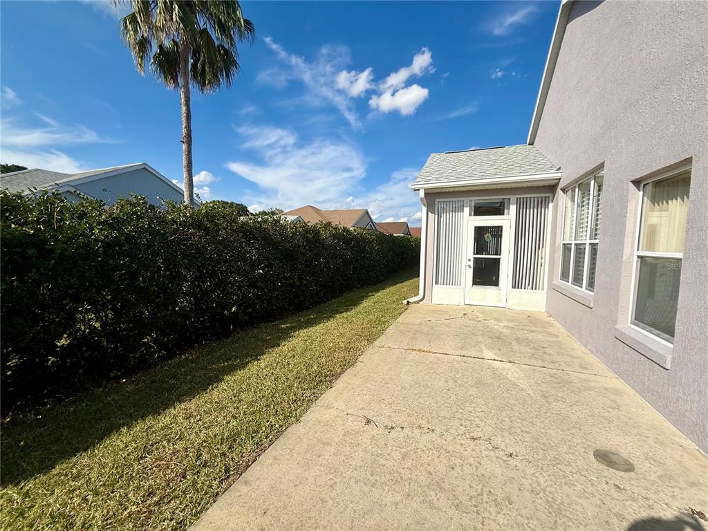 11122 Southwest 73rd Court Ocala, FL 34476 - Photo 34 of 36 a view of a house with backyard and a yard