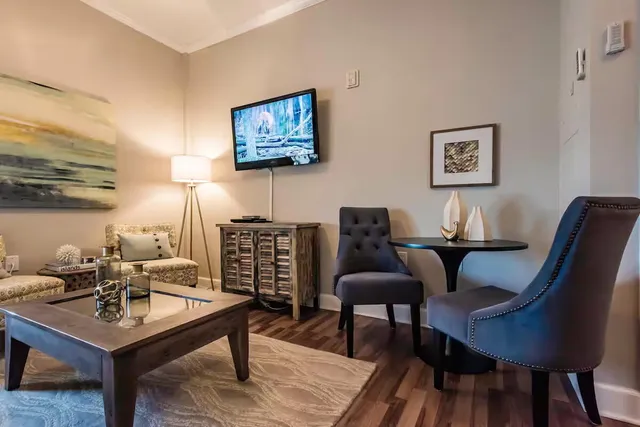 a view of a workspace with furniture