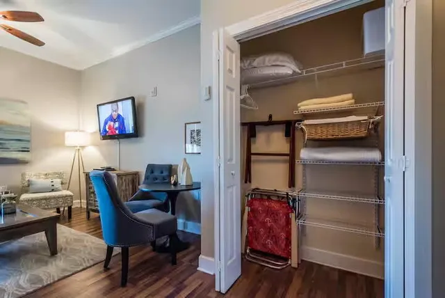 a view of a livingroom with furniture and wooden floor