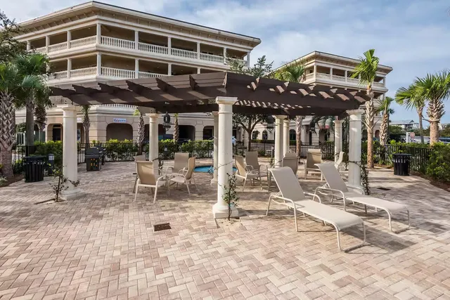 a view of a building with sitting area