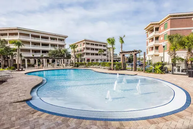 a view of a building with view of a swimming pool