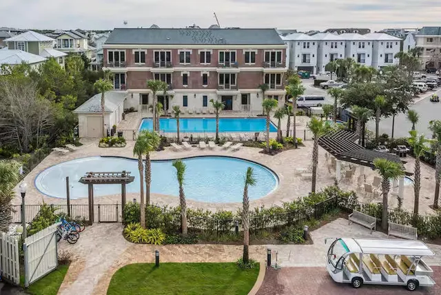 a view of a building with a garden and plants