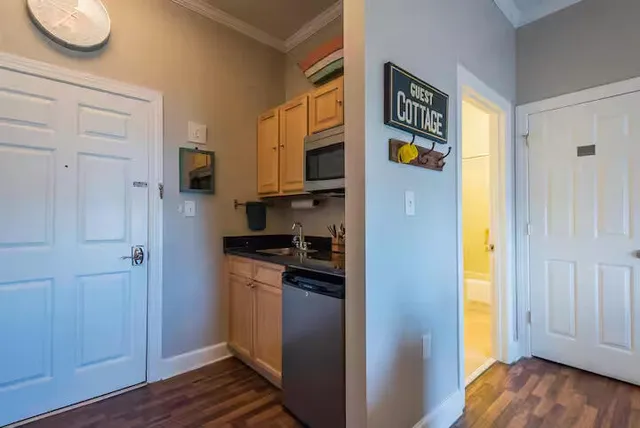 a kitchen with stainless steel appliances granite countertop a refrigerator and a stove