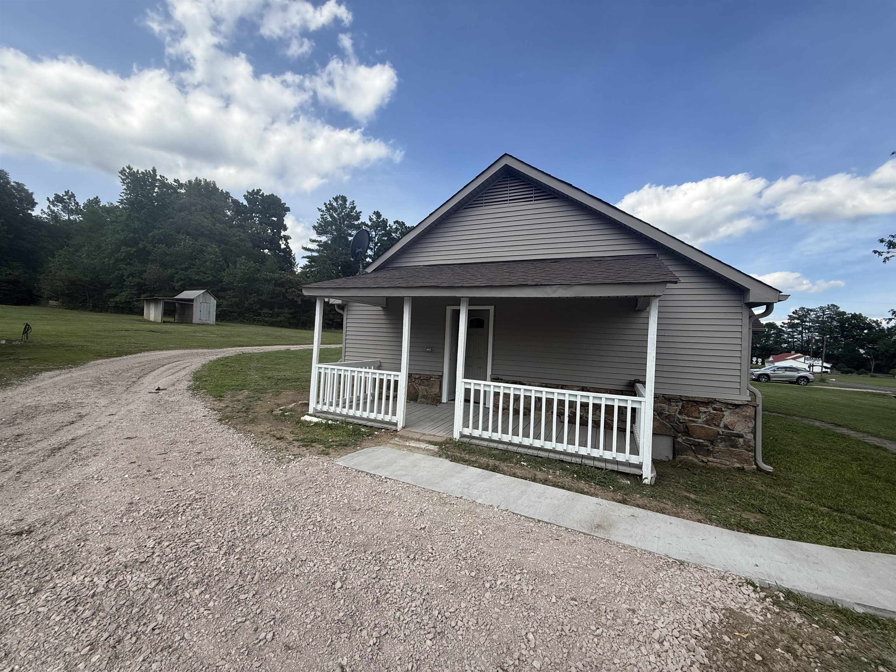 170 Leapwood Road Enville, TN 38332 - Photo 3 of 33 Exterior featuring horizontal siding and a covered front porch with white railings