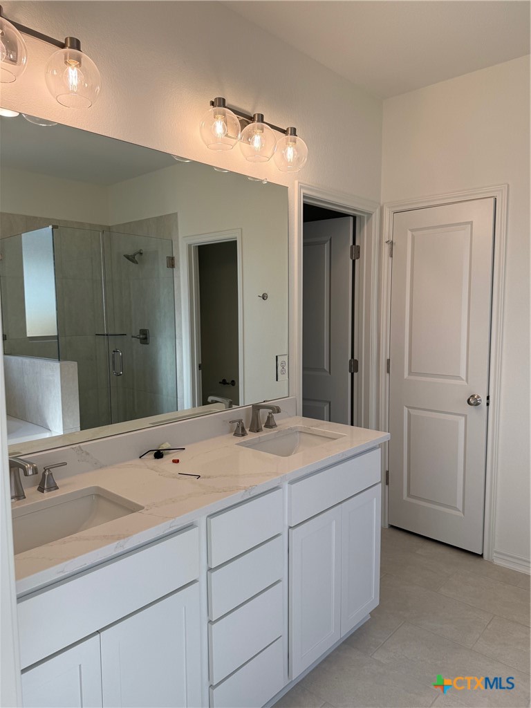 7117 Touchstone Drive Temple, TX 76502 - Photo 12 of 13 a bathroom with a sink and a mirror