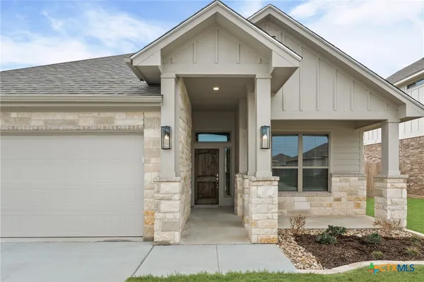 a front view of a house with a garage