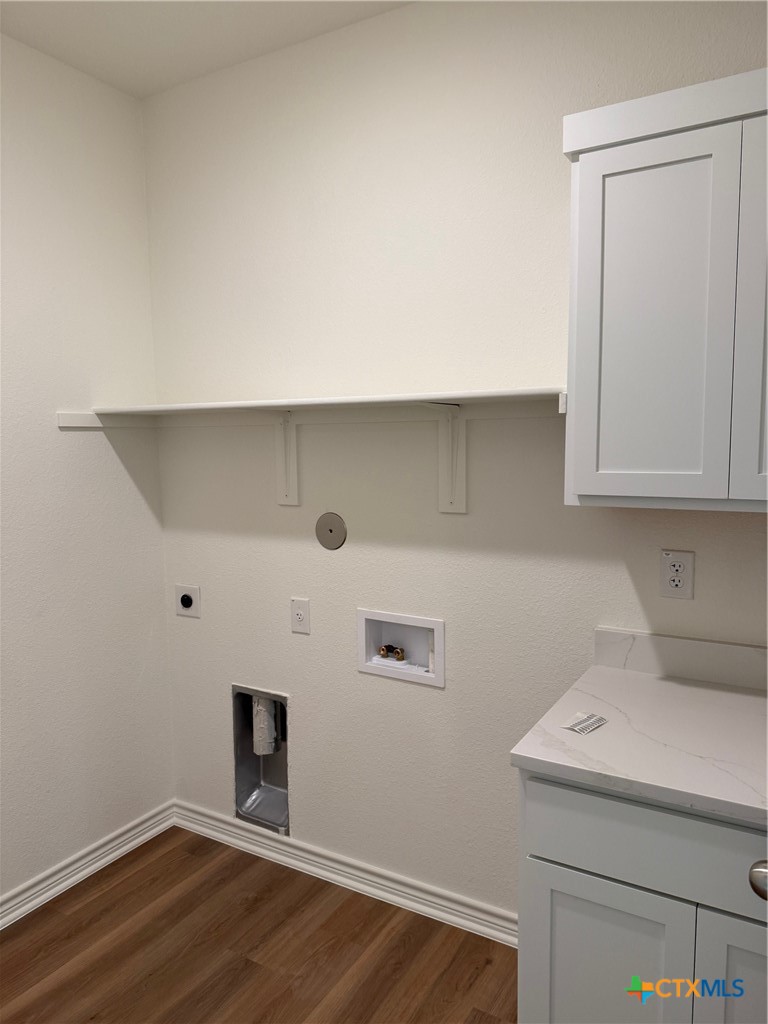 7117 Touchstone Drive Temple, TX 76502 - Photo 6 of 13 a room with a wooden floor and white walls