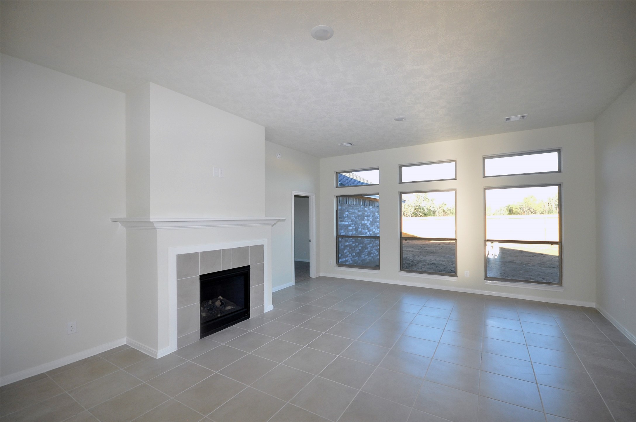 3502 Bahia Road League City, TX 77573 - Photo 6 of 40 an empty room with windows and fireplace