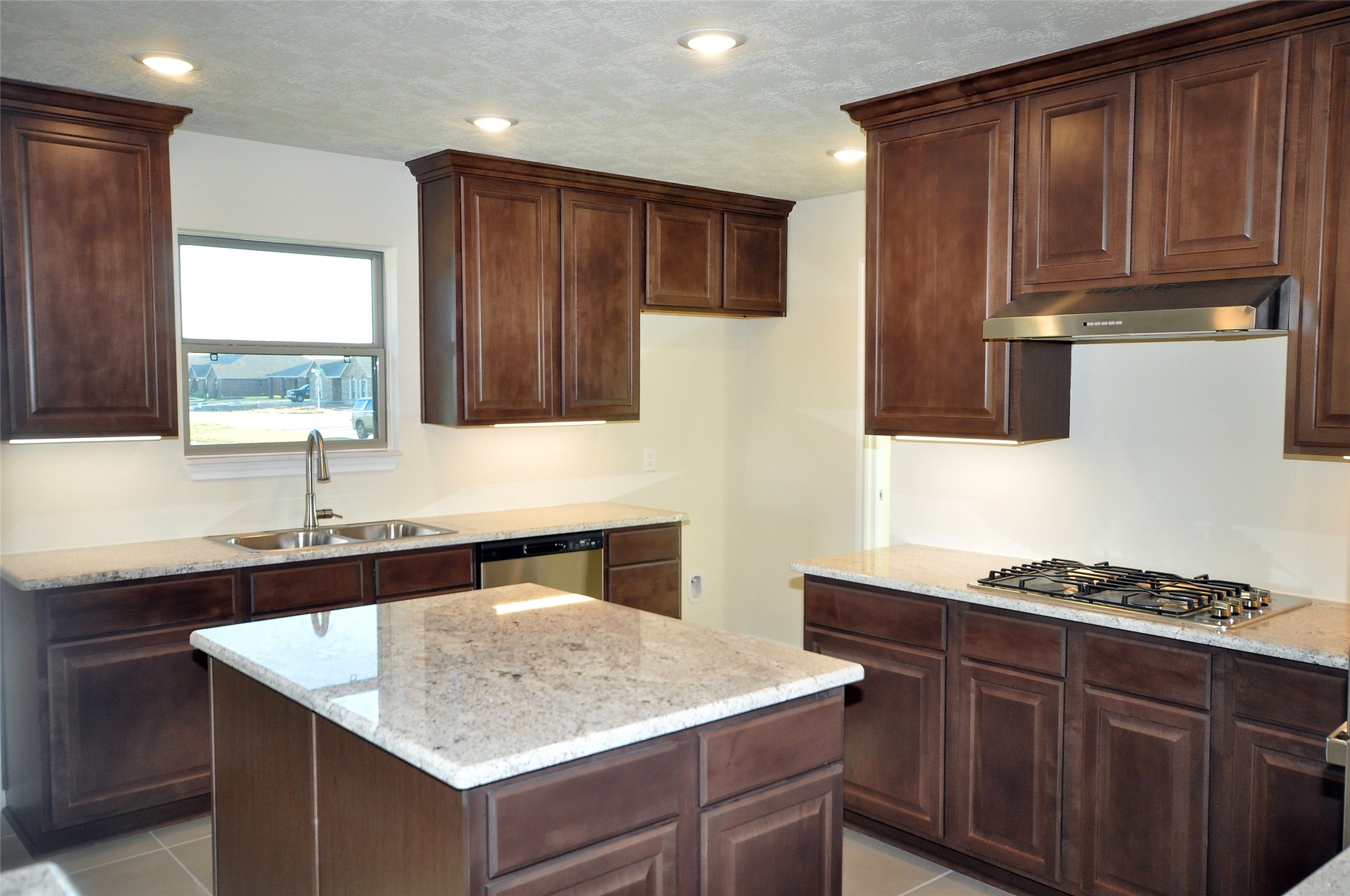 3502 Bahia Road League City, TX 77573 - Photo 8 of 40 a kitchen with stainless steel appliances granite countertop a sink stove and cabinets