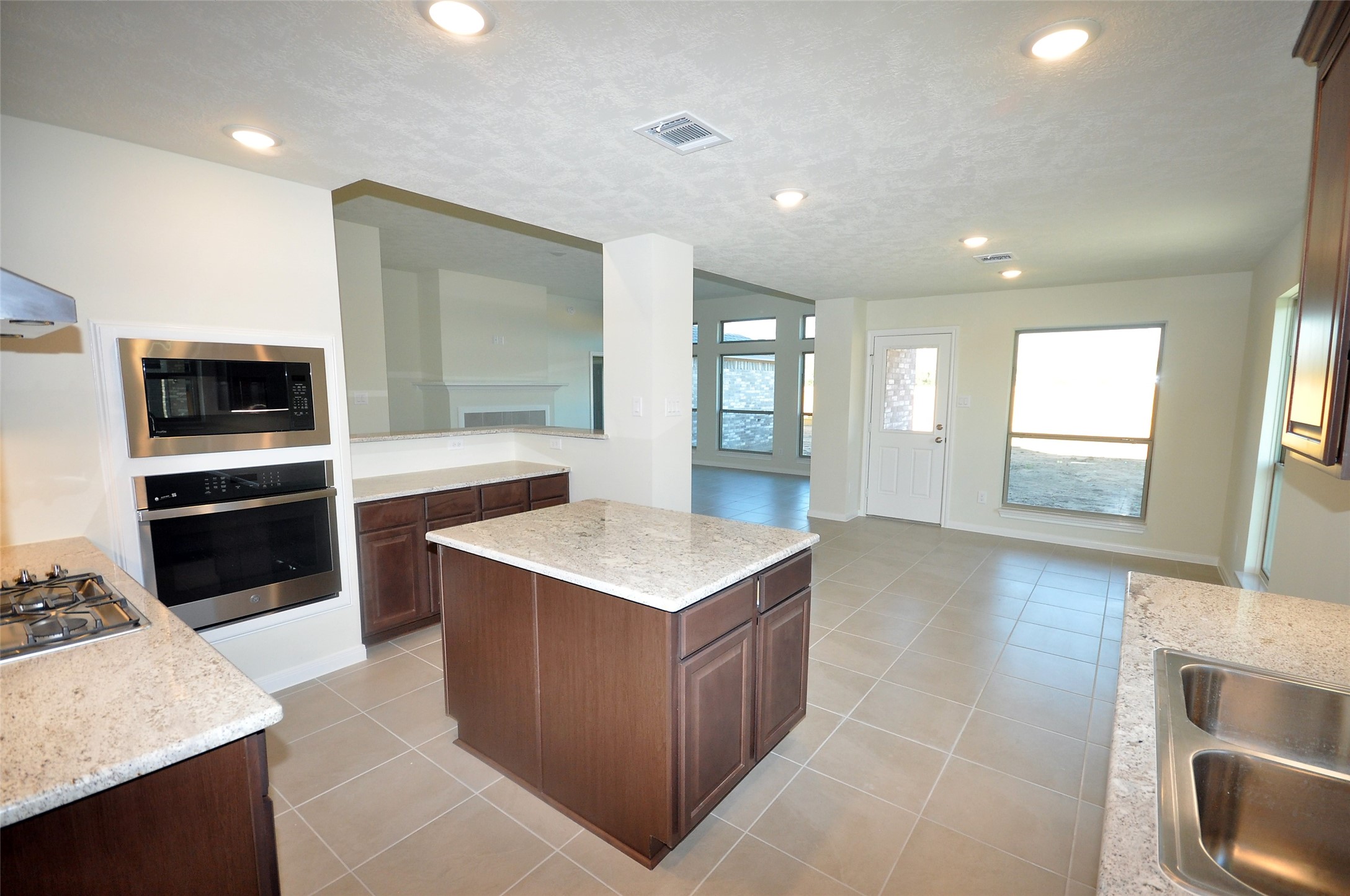 3502 Bahia Road League City, TX 77573 - Photo 10 of 40 a kitchen with a sink stove and refrigerator