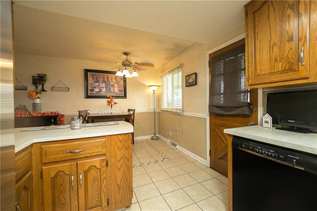 3400 Pittsburgh Road Perryopolis, PA 15473 - Photo 7 of 23 a kitchen with stainless steel appliances granite countertop a sink stove and refrigerator