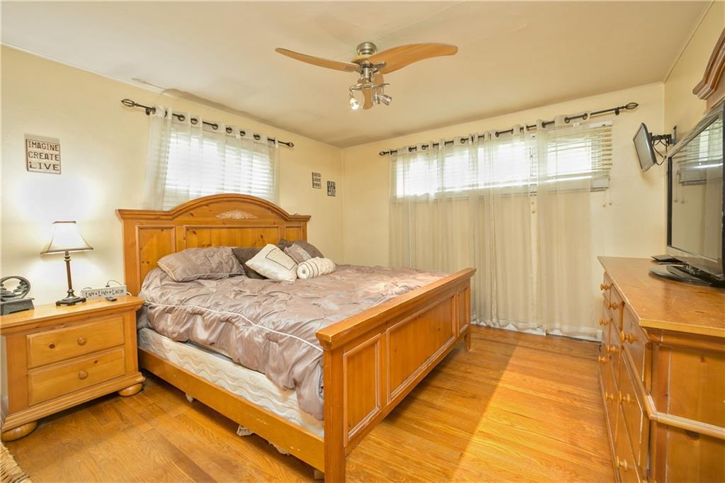 3400 Pittsburgh Road Perryopolis, PA 15473 - Photo 9 of 23 a spacious bedroom with a bed and a chandelier