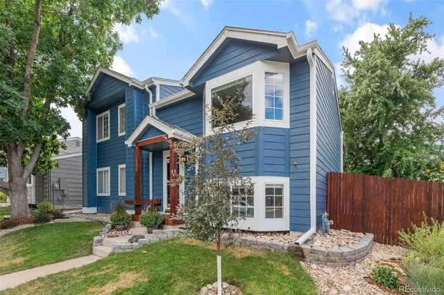 front view of a house with a yard