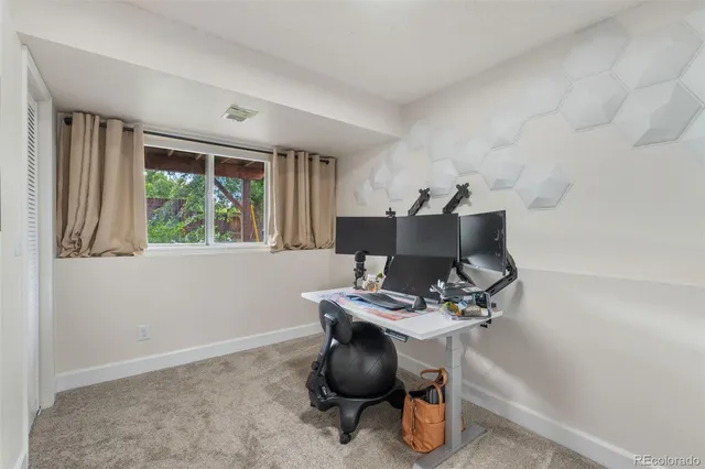 a work room with furniture and windows