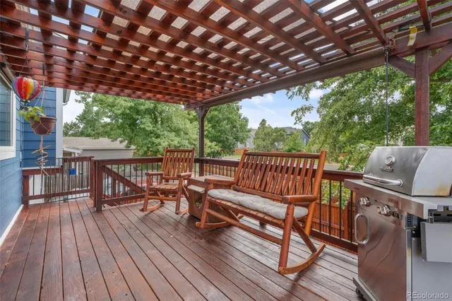 a view of a chairs on wooden deck