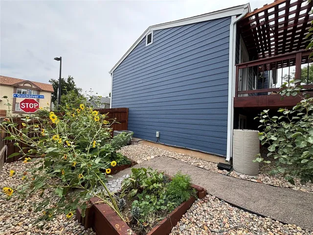 a view of a backyard with wooden fence