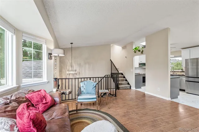 a view of a livingroom with furniture and windows