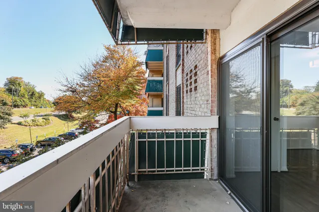 a balcony with view of outdoor space