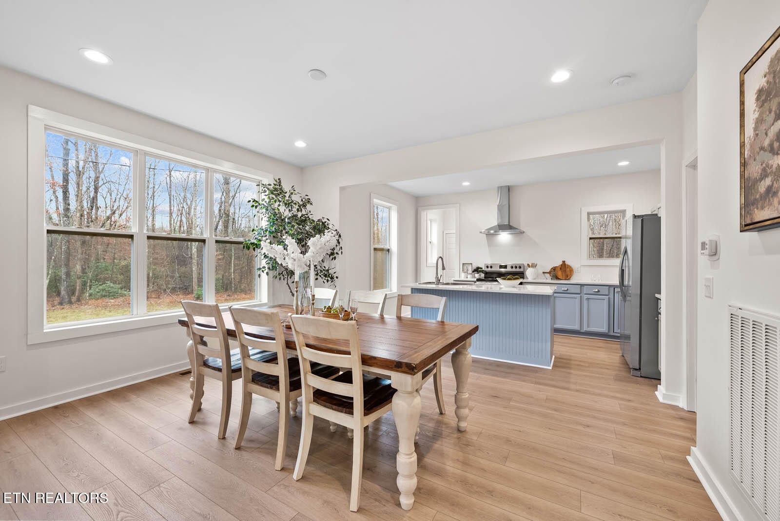 1023 West Laurel Way Monterey, TN 38574 - Photo 11 of 60 a dining area with furniture window and wooden floor