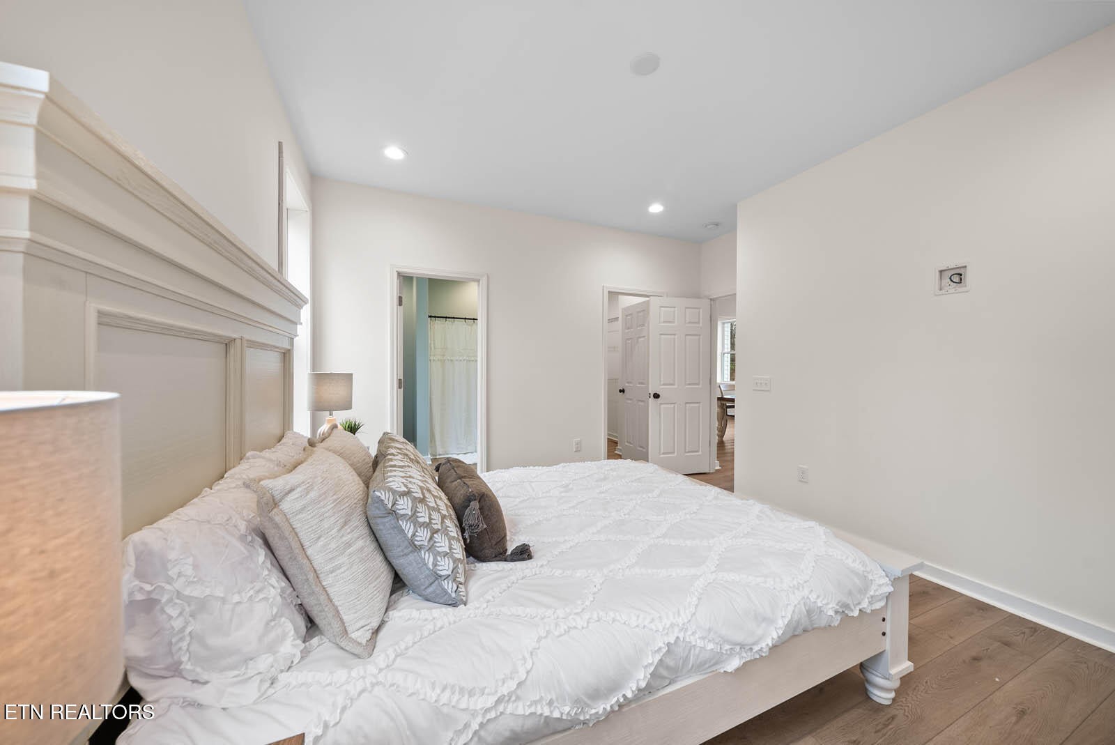 1023 West Laurel Way Monterey, TN 38574 - Photo 20 of 60 a large white bed in a white room