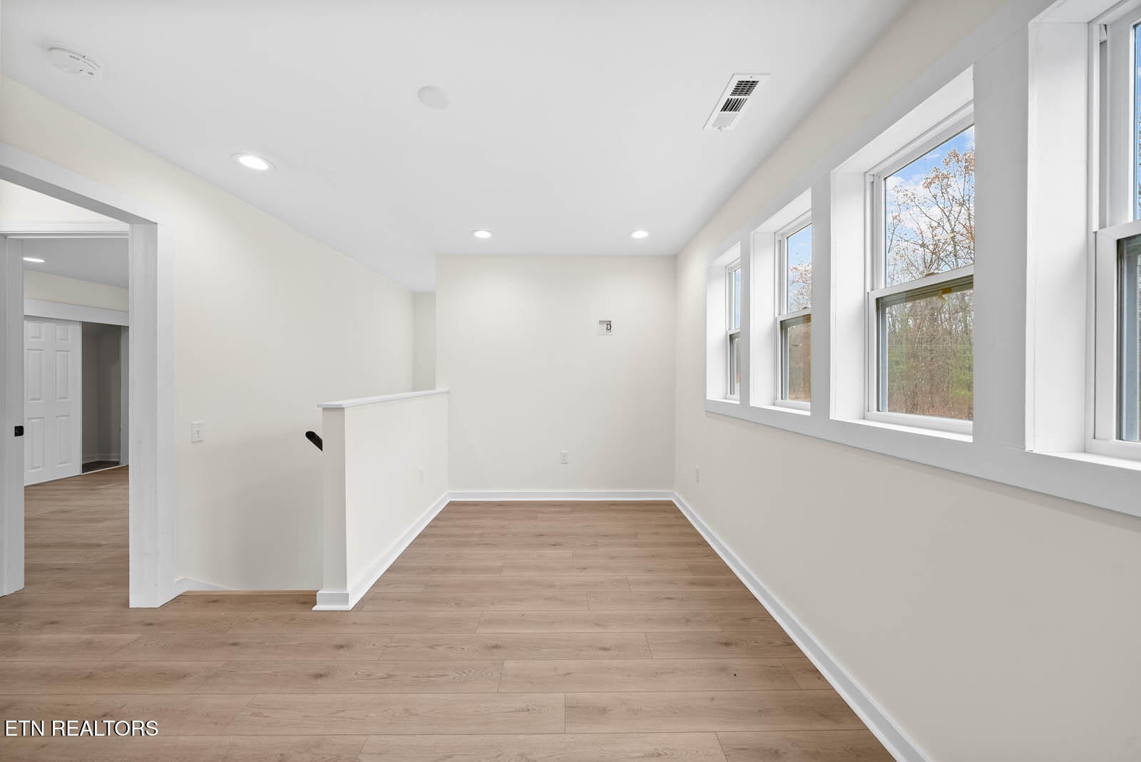 1023 West Laurel Way Monterey, TN 38574 - Photo 29 of 60 a view of an empty room with wooden floor and a window