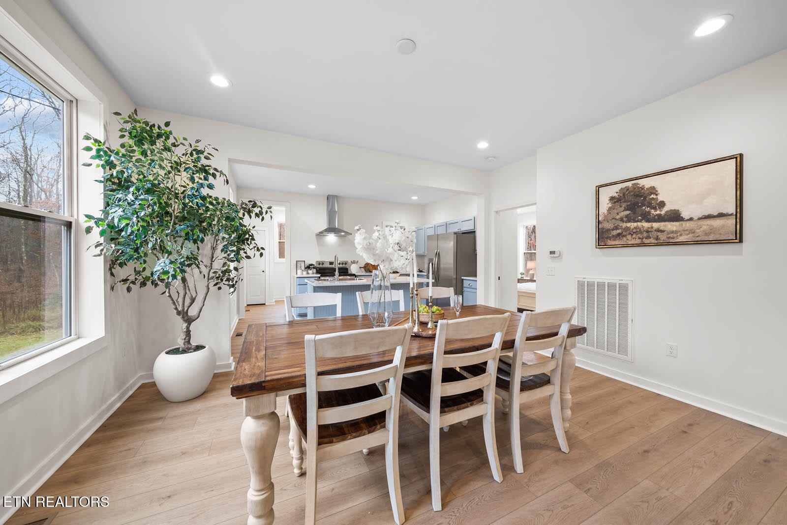 1023 West Laurel Way Monterey, TN 38574 - Photo 36 of 60 a dining room with furniture potted plants and wooden floor